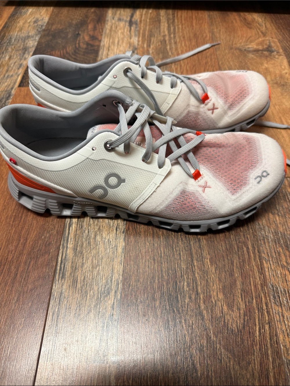 On Running Women’s Athletic Shoes in White with Coral Accents